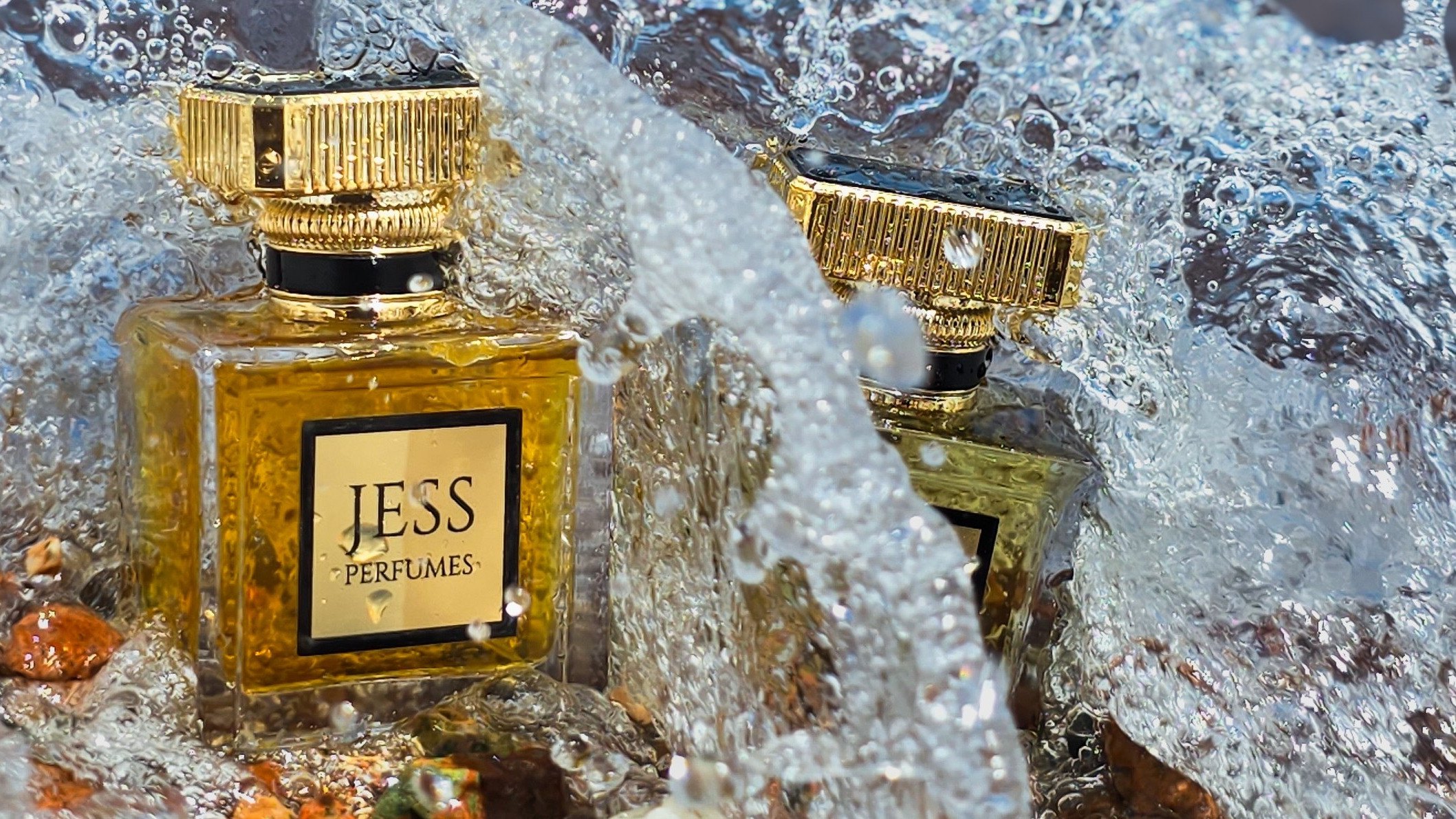 Jess perfume bottles in the surf